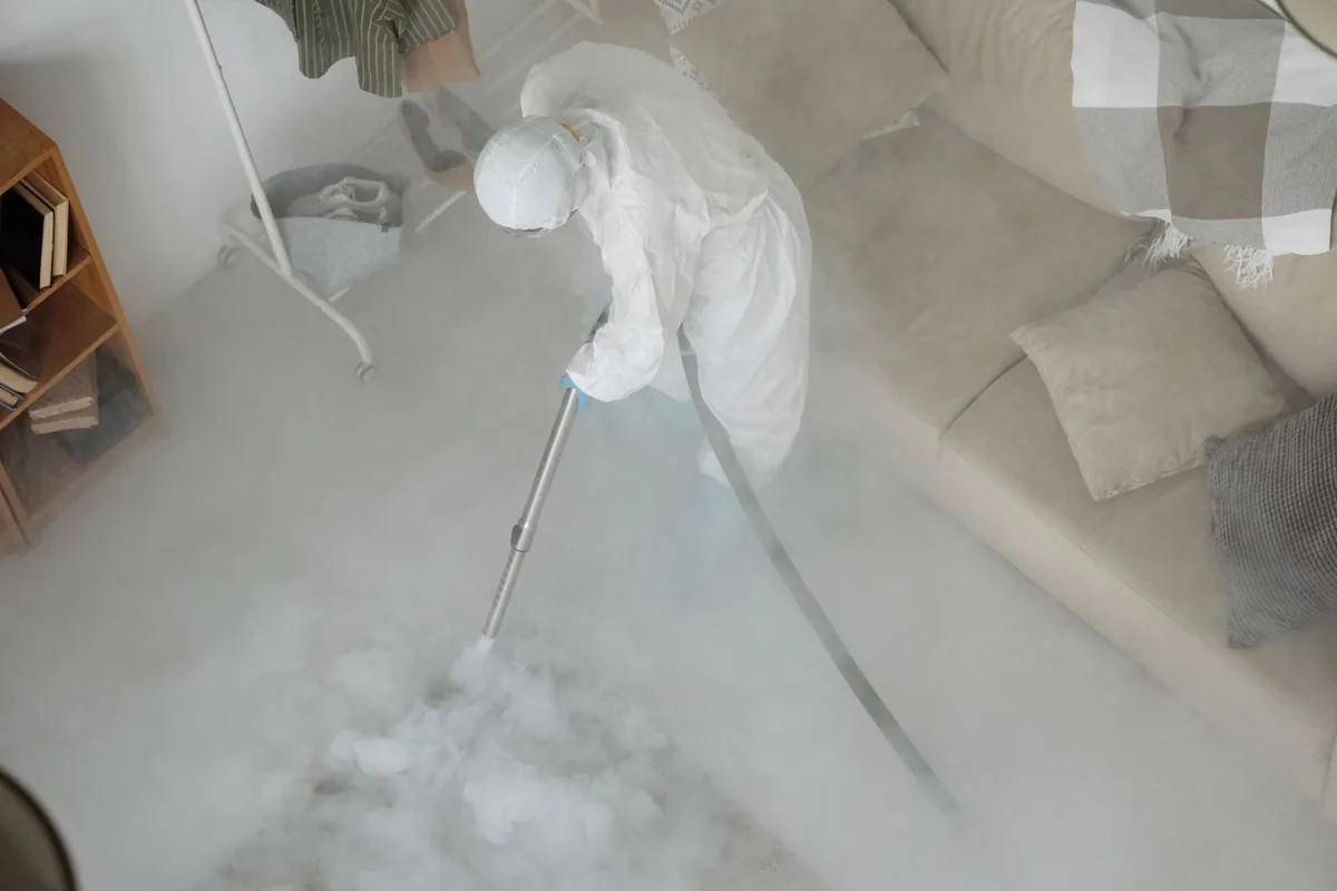 Biohazard cleanup technician in protective equipment, Garden City, KS
